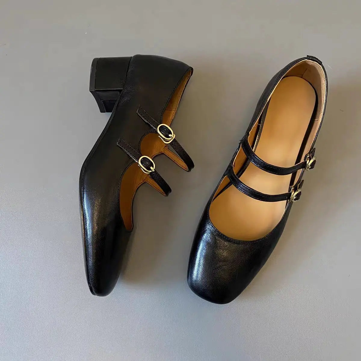 Top and side view of black genuine leather Mary Jane pumps